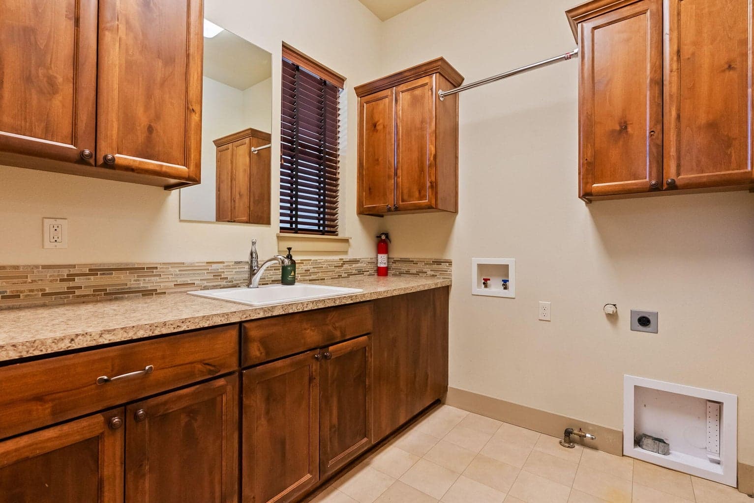 Laundry room with gas or electric hookup for dryer