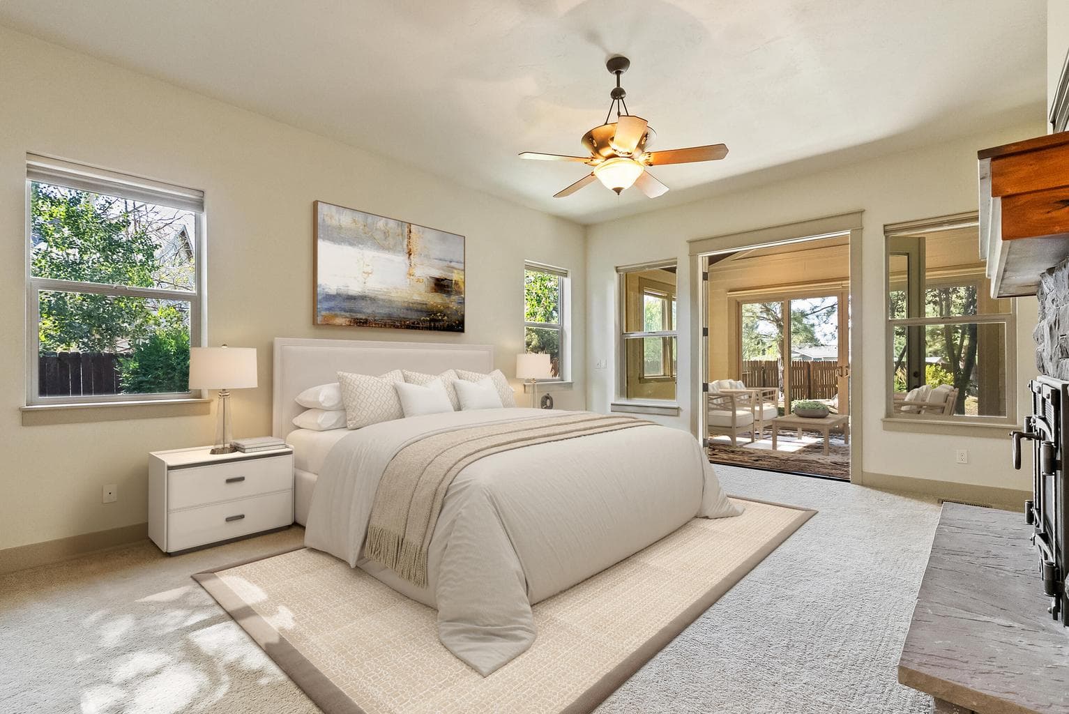 Primary suite with enclosed patio/sunroom (virtually staged)
