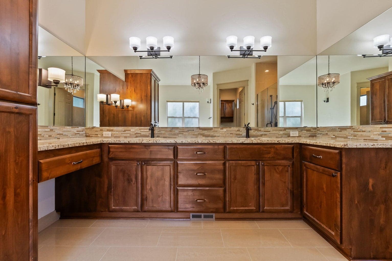 Primary bath with double sinks and makeup vanity