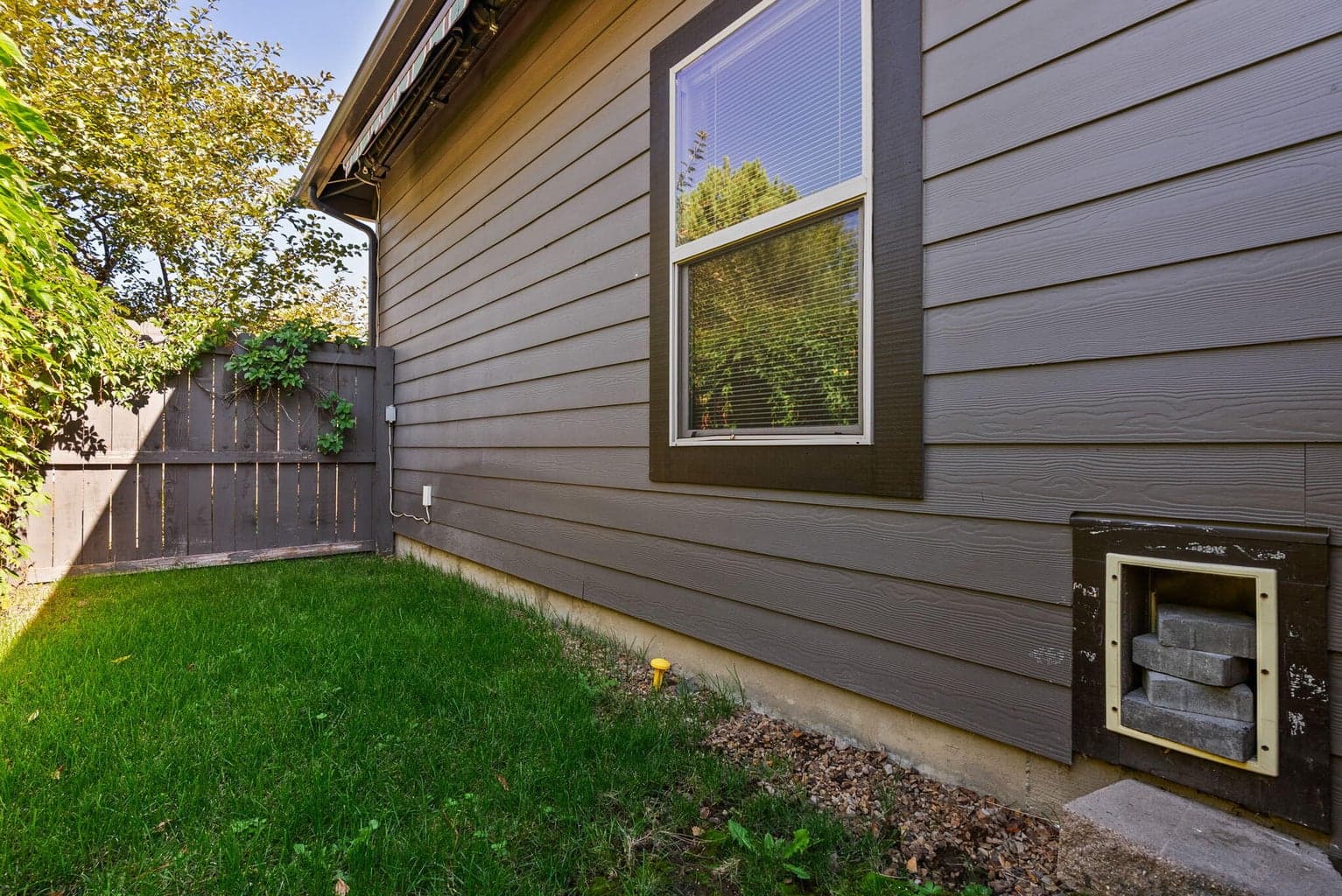 Outdoor run with pet door into kennel room