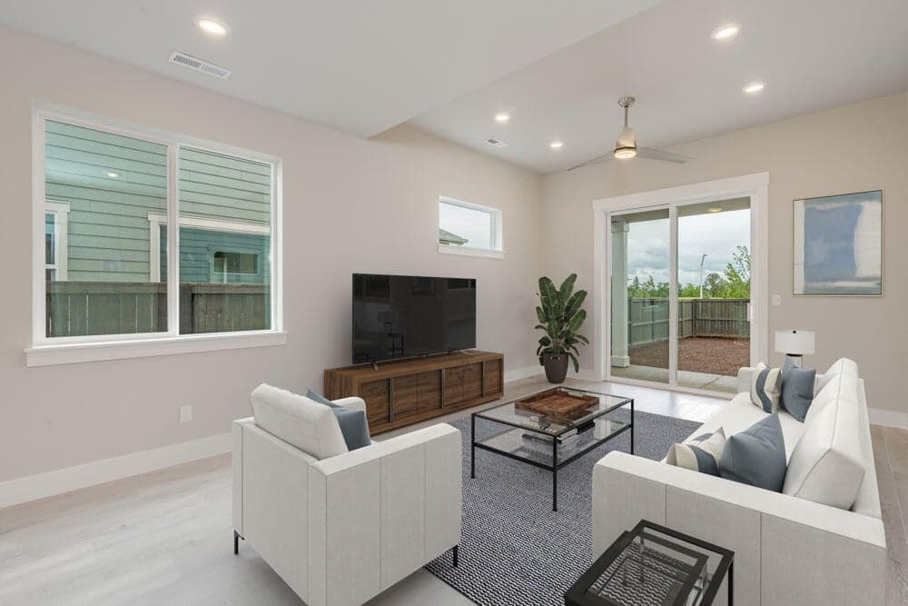 Greatroom with luxury vinyl plank floors and lots of windows. photos are virtually staged.