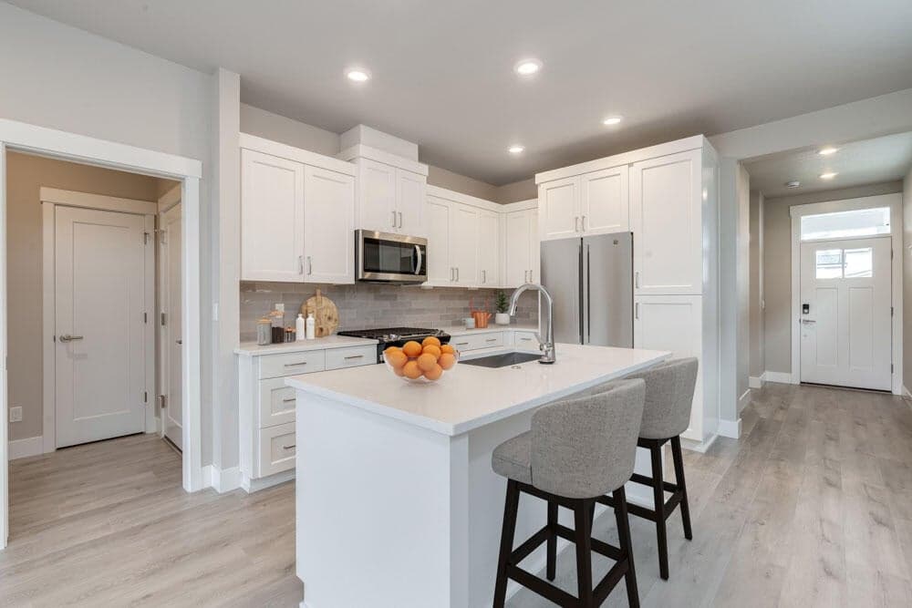 Kitchen with luxury vinyl plank floors and quartz counters and stainless appliances. photos are virtually staged.
Public