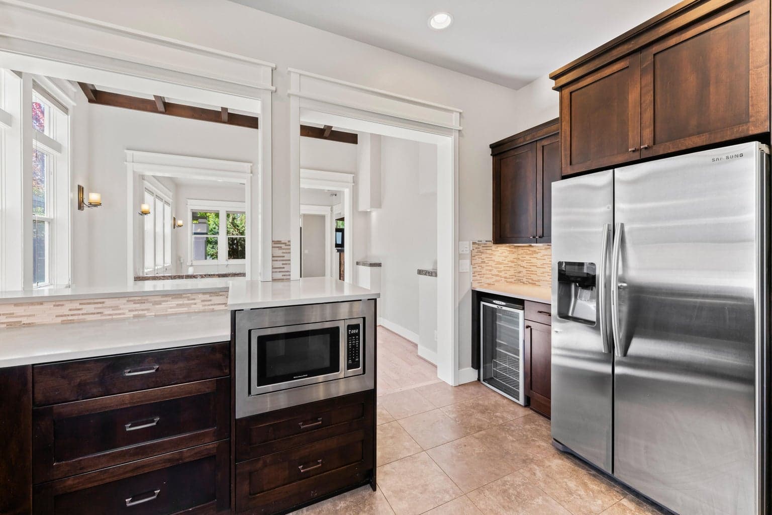 Includes a large side by side fridge/freezer and separate wine fridge