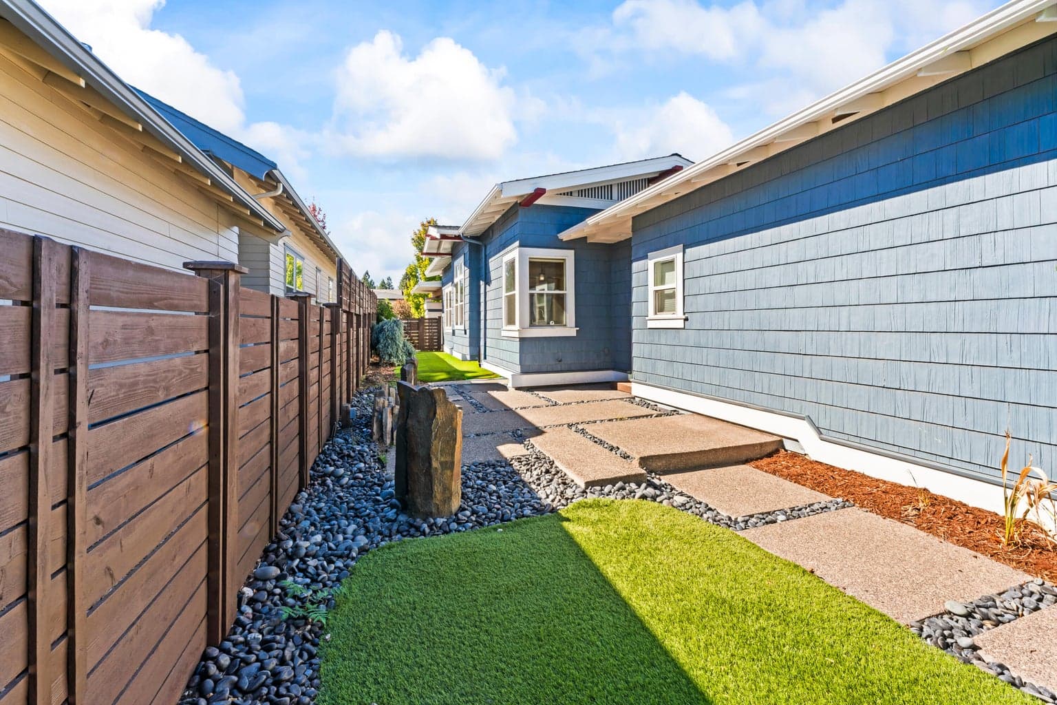 Includes a stone water feature and gas firepit