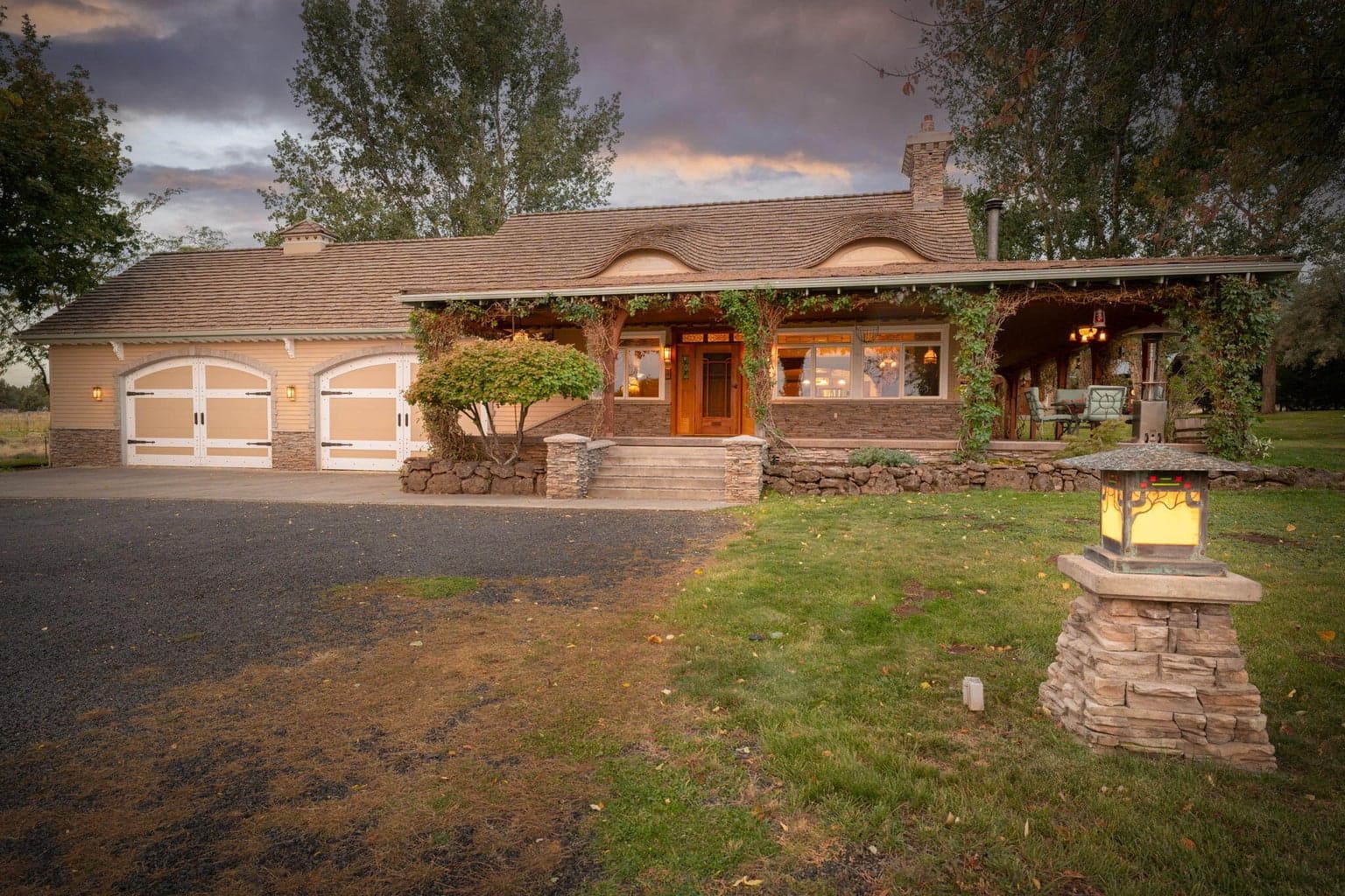 Beautiful Bear Creek Ranch w/4 car garage, fully landscaped and hand forged lighting