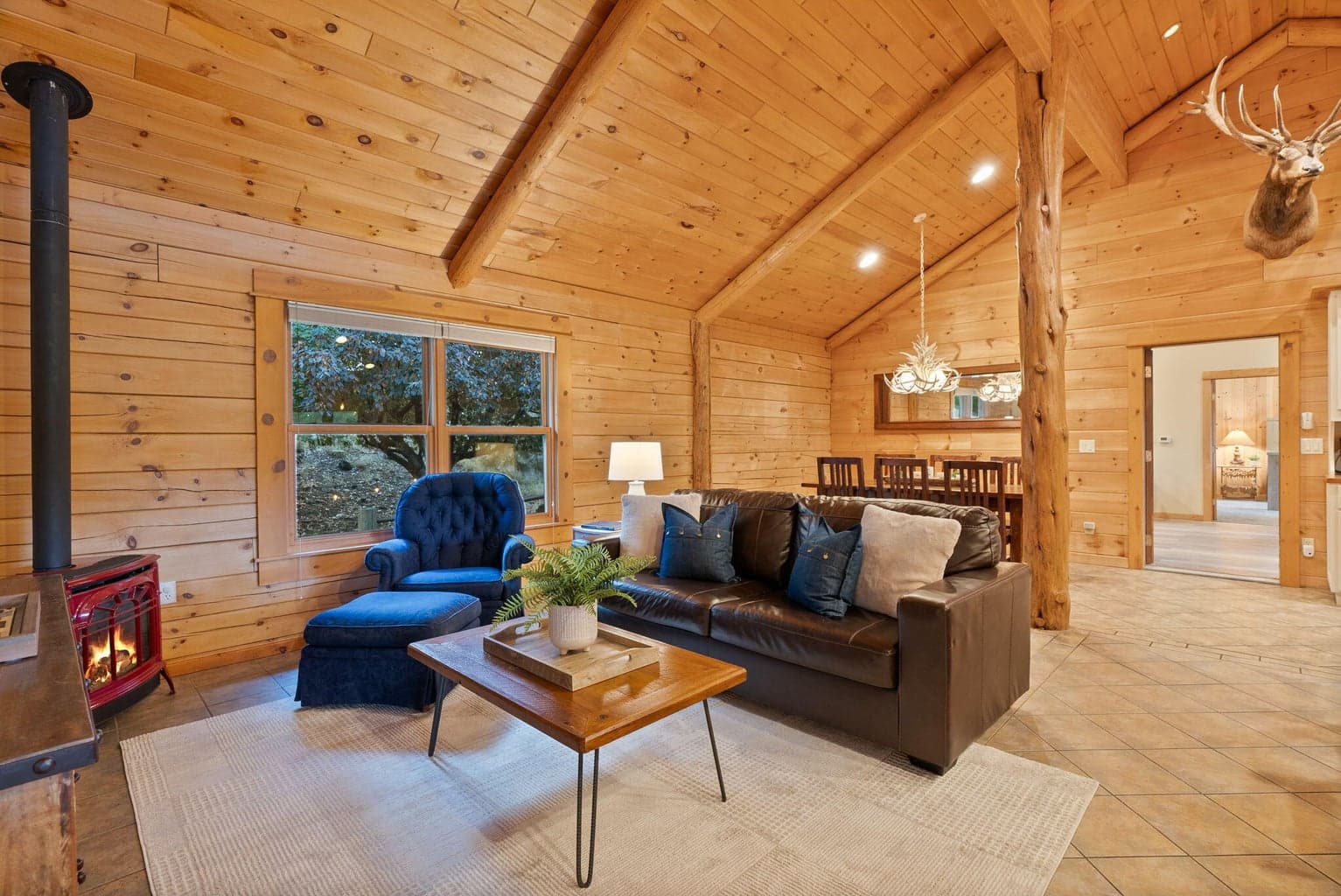 Charming and open to the Kitchen and Dining with cozy gas stove.