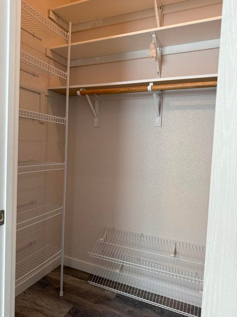 Primary bedroom walk-in closet