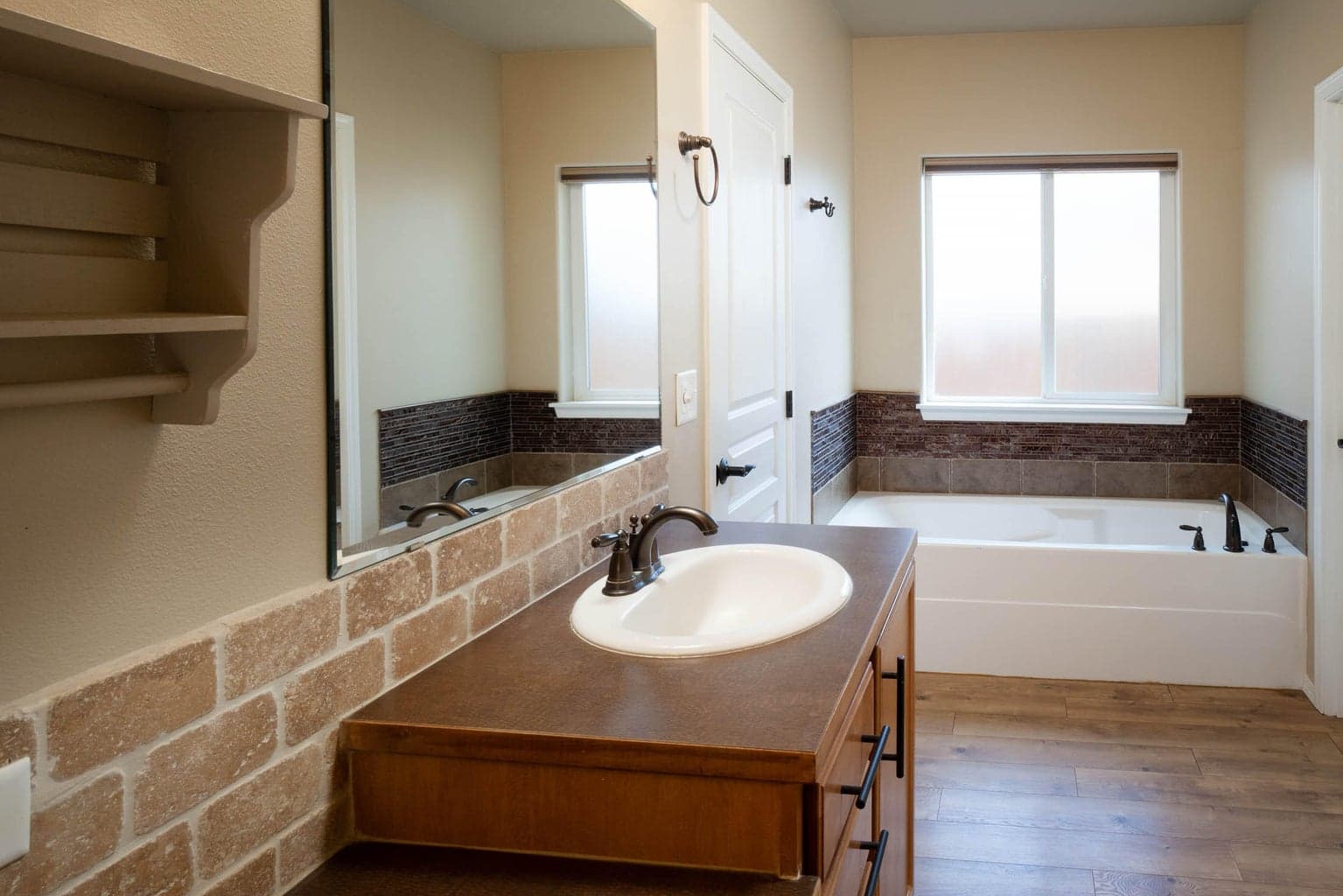 Dual sinks, soaking tub private toilet, walk-in shower, ample storage