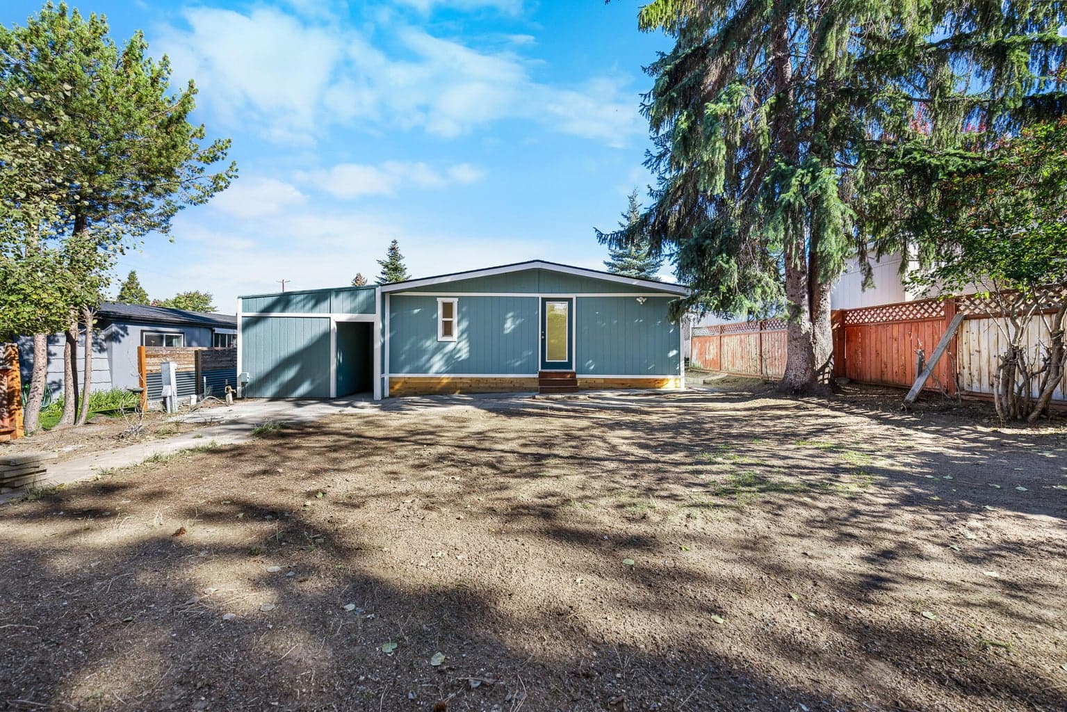 Backyard is large. Home has all new drywall, plumbing, electrical, a new roof and all new exterior paint.
