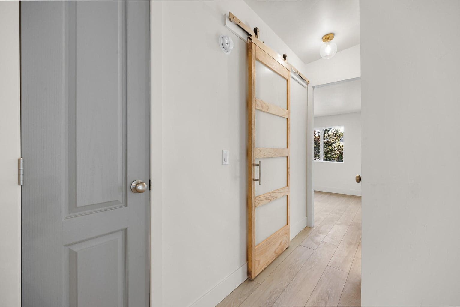 Custom painted doors throughout, guest bath has a custom barn door.