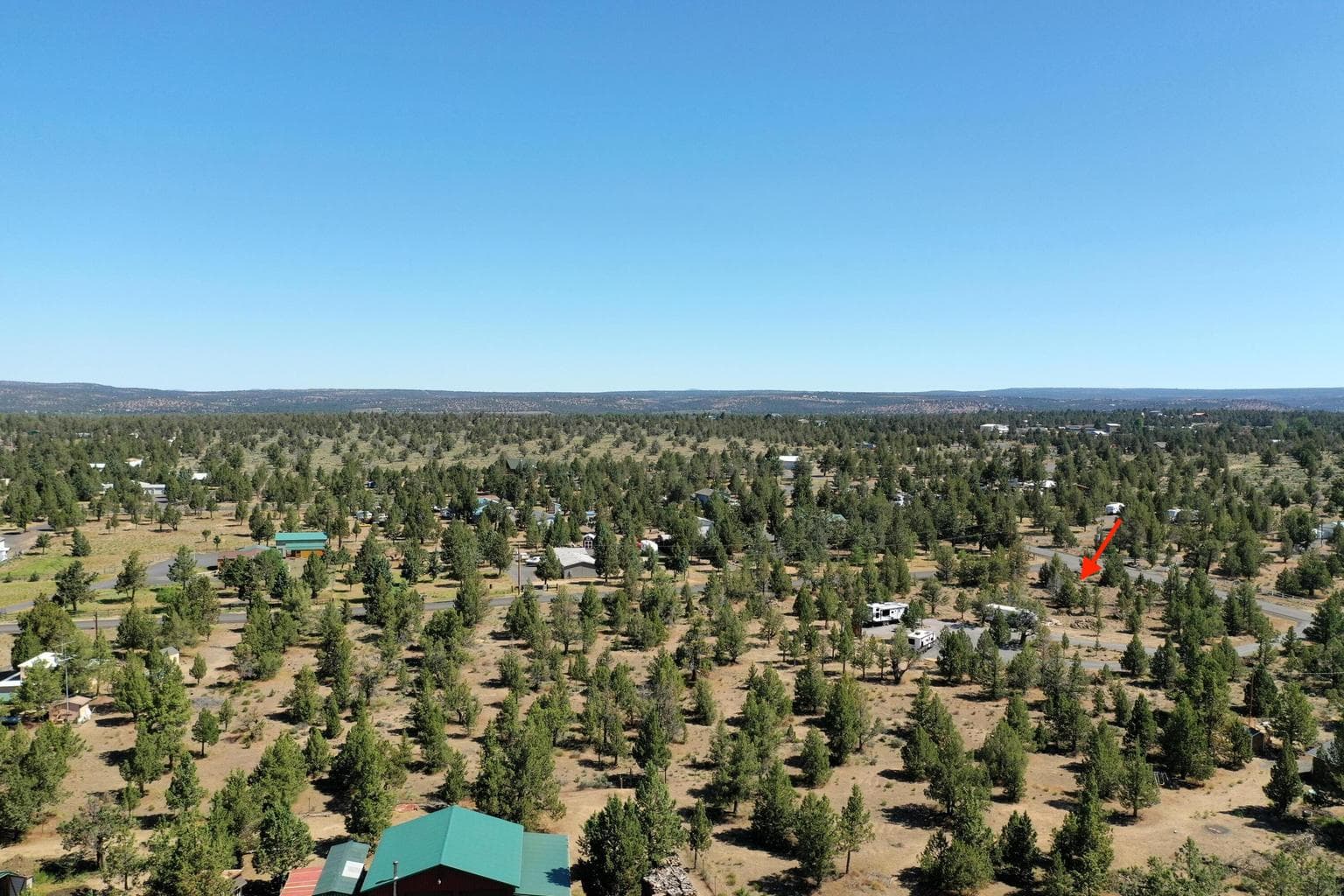 Flat, sunlit area ready for your custom home, shop, or retreat cabin.