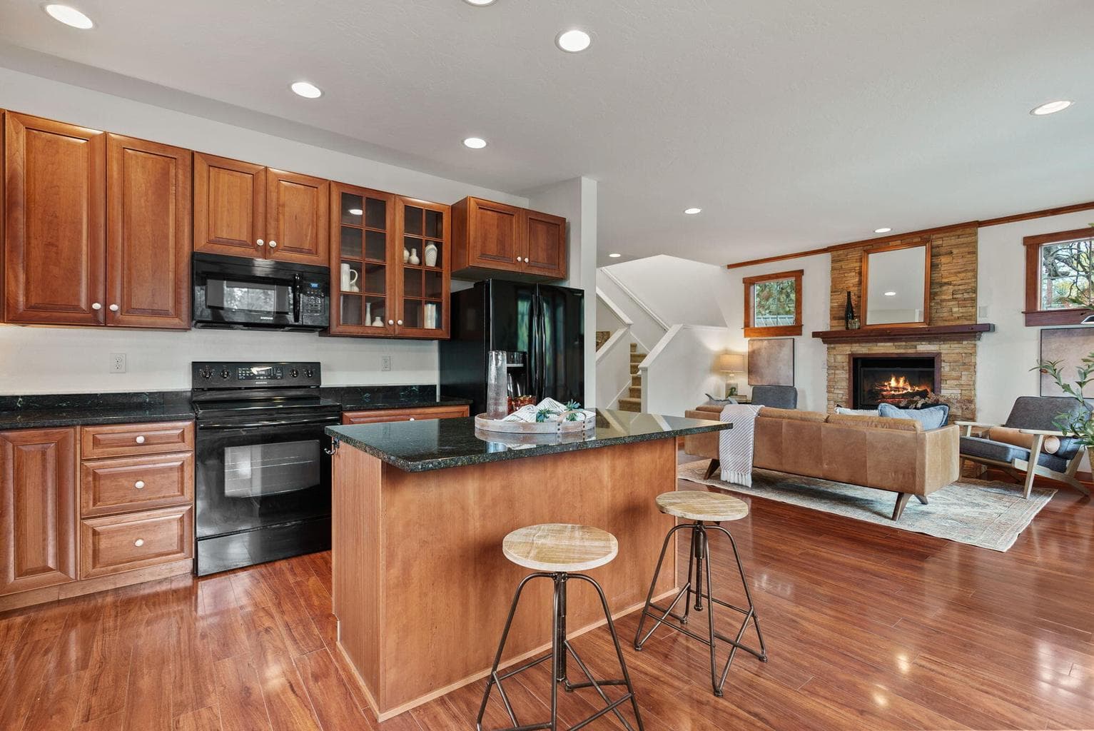 Great Room, Kitchen, Dining Area: Kitchen Island with Breakfast Bar, Soft-Close Cherry Cabinets, Pantry Cupboard, and Granite Countertops