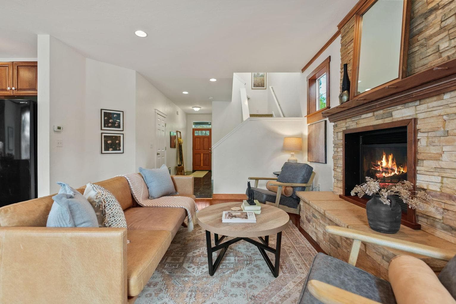 1,635 SF home features 3-bedrooms, 2.5-baths, a loft, and Great Room with a propane fireplace, kitchen and dining area.