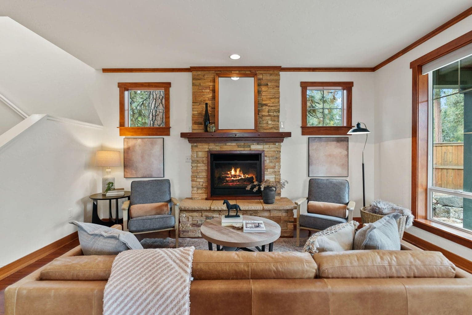 1,635 SF home features 3-bedrooms, 2.5-baths, a loft, and Great Room with a propane fireplace, kitchen and dining area.