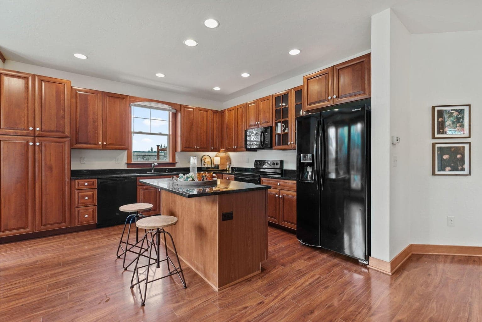 Great Room, Kitchen, Dining Area: Kitchen Island with Breakfast Bar, Soft-Close Cherry Cabinets, Pantry Cupboard, and Granite Countertops