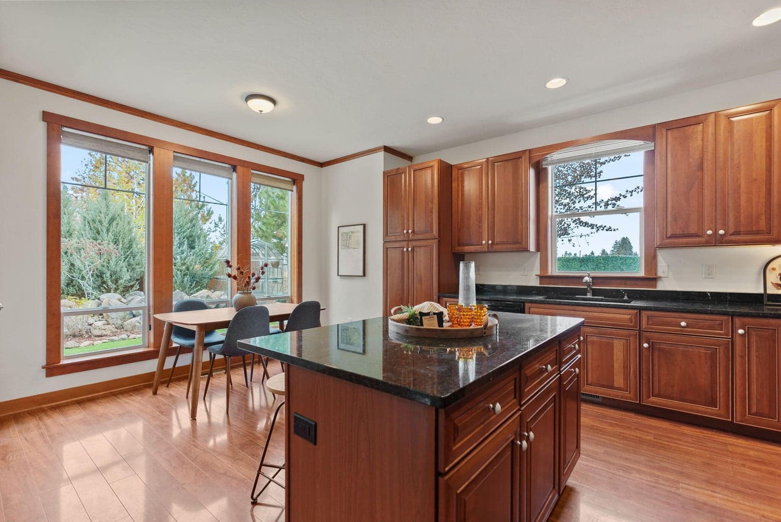 Great Room, Kitchen, Dining Area: Kitchen Island with Breakfast Bar, Soft-Close Cherry Cabinets, Pantry Cupboard, and Granite Countertops
