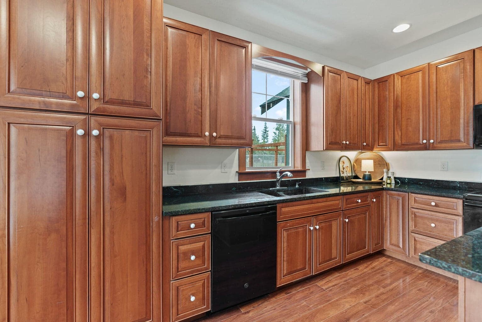 Great Room, Kitchen, Dining Area: Kitchen Island with Breakfast Bar, Soft-Close Cherry Cabinets, Pantry Cupboard, and Granite Countertops