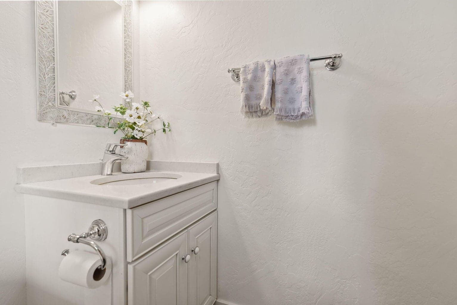 Front entry with half bath, green marble tiled entry, under-stair storage closet