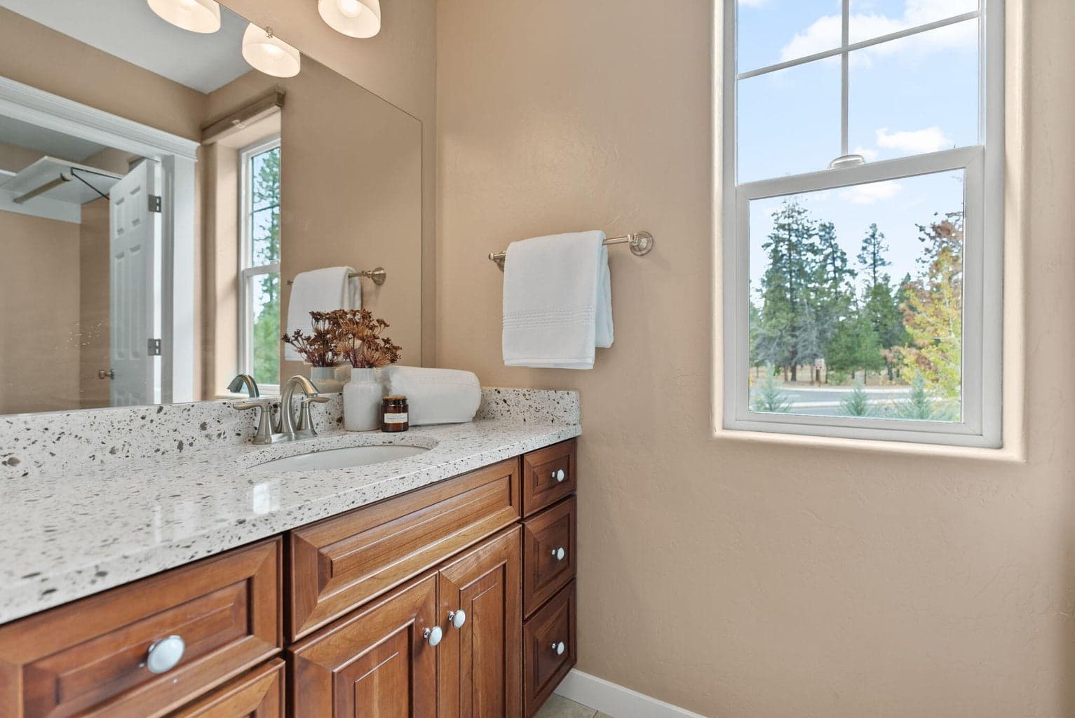 Upstairs primary suite with 2 walk-in closets, 2 vanities, and a separate commode and shower/tub