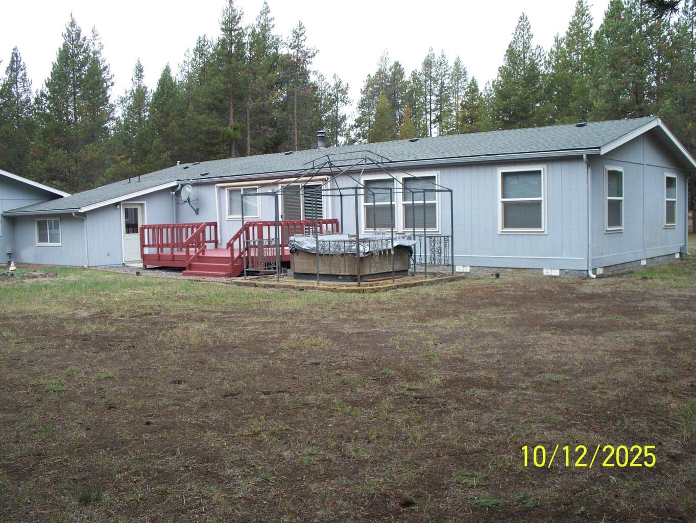 Back of home with Hot Tub