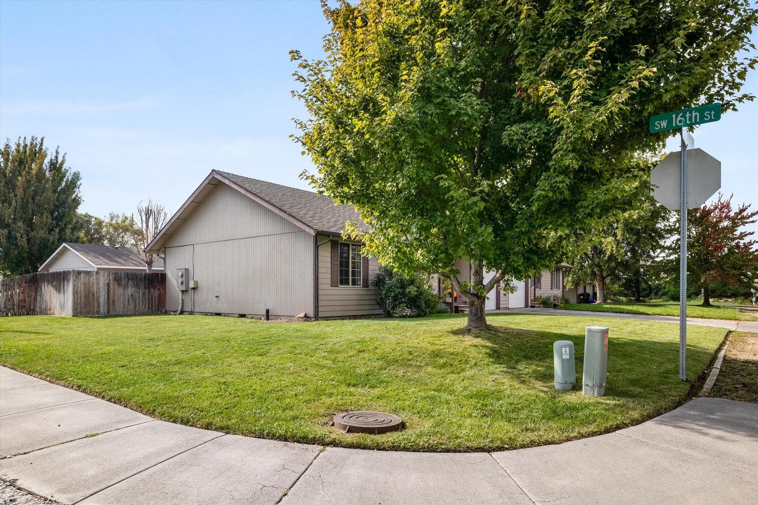 Large corner lot shows the 1614 unit