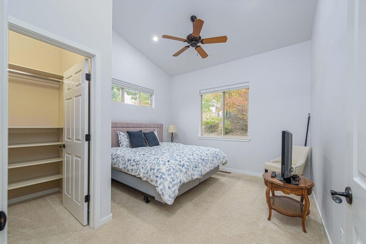 Second ensuite bedroom on the main level with a walk in closet