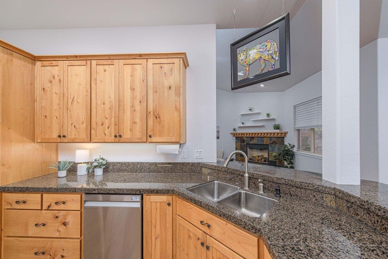 Lots of cabinetry and a corner pantry in the kitchen provides ample storage