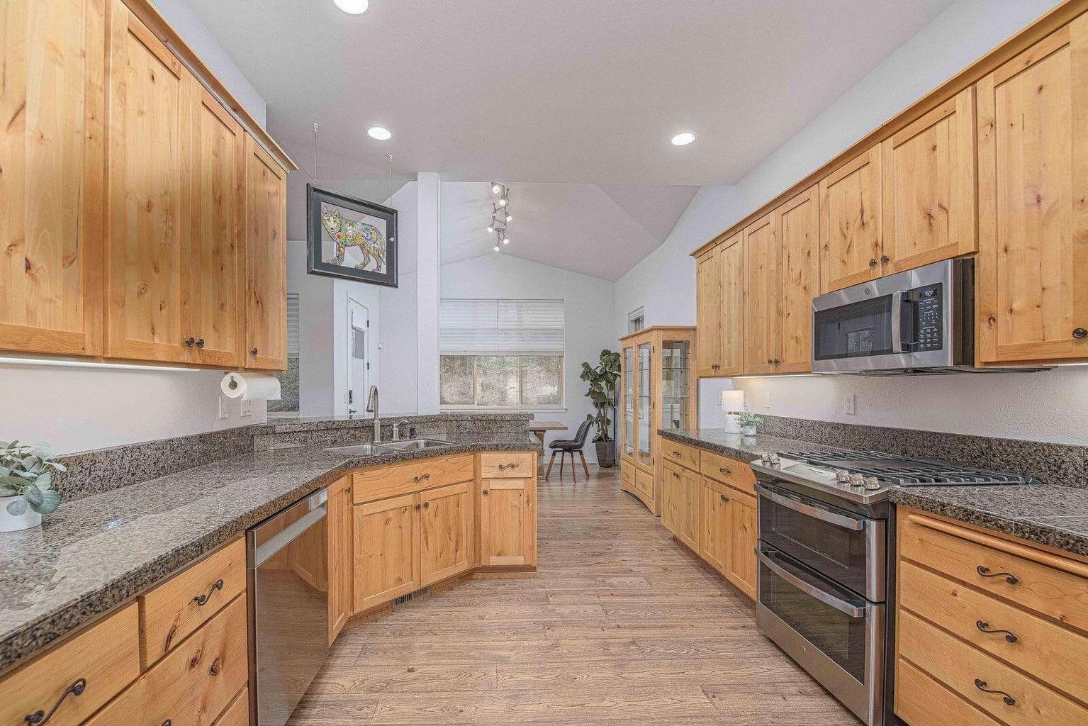 The kitchen has newer stainless steel appliances
