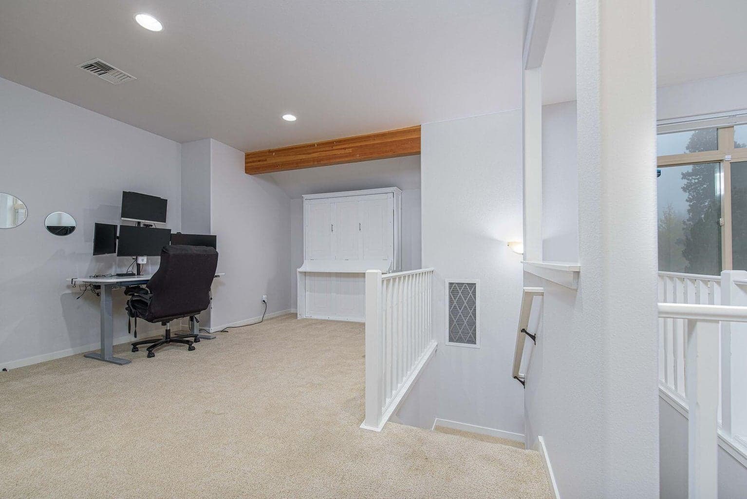 Loft area/flex space on both sides of the staircase
