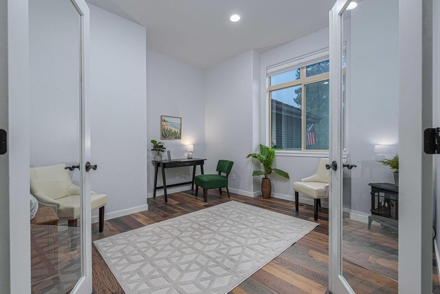 Office with double glass doors right off the entry