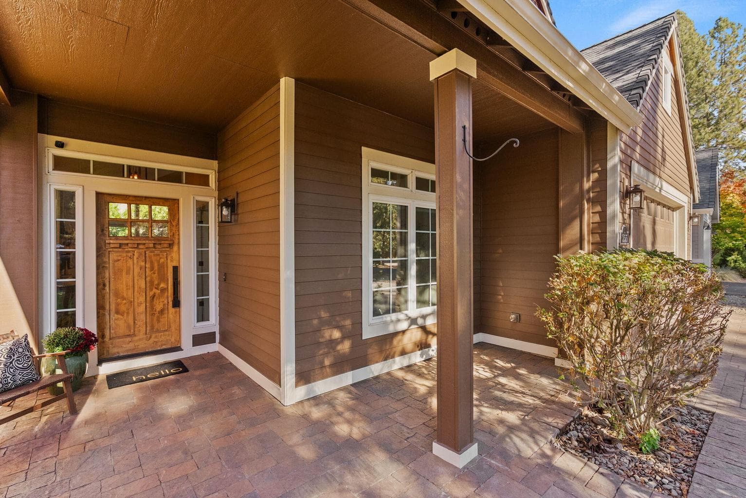 Paver-covered front porch area and front door