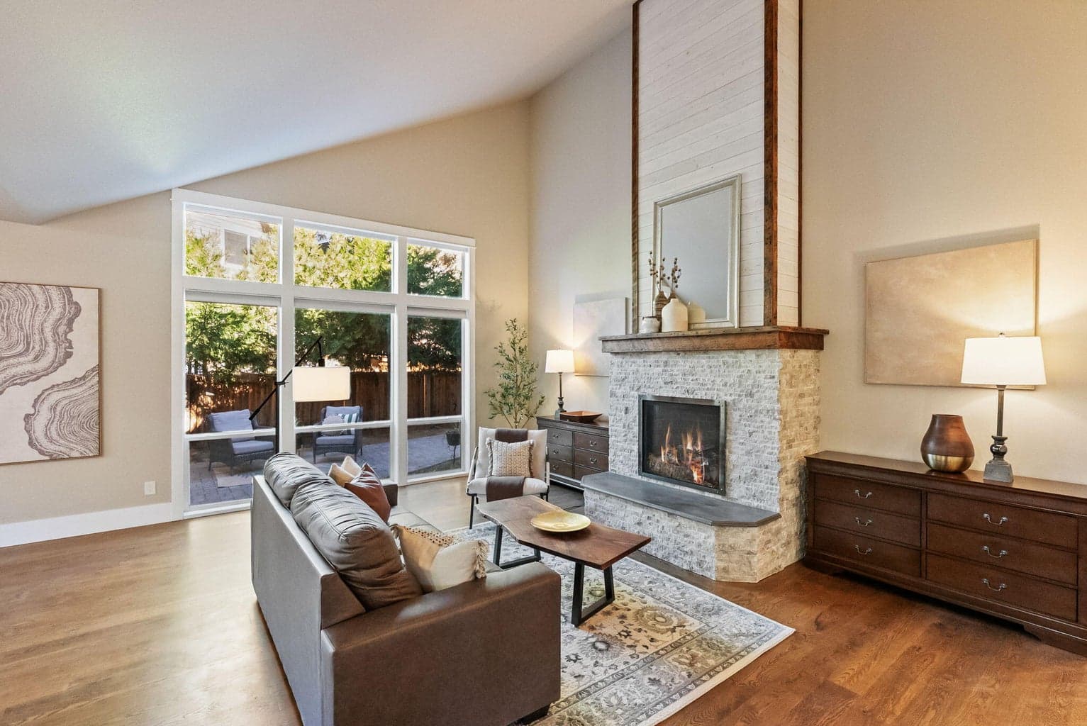 Great room with vaulted ceilings, propane fireplace and hardwood floors