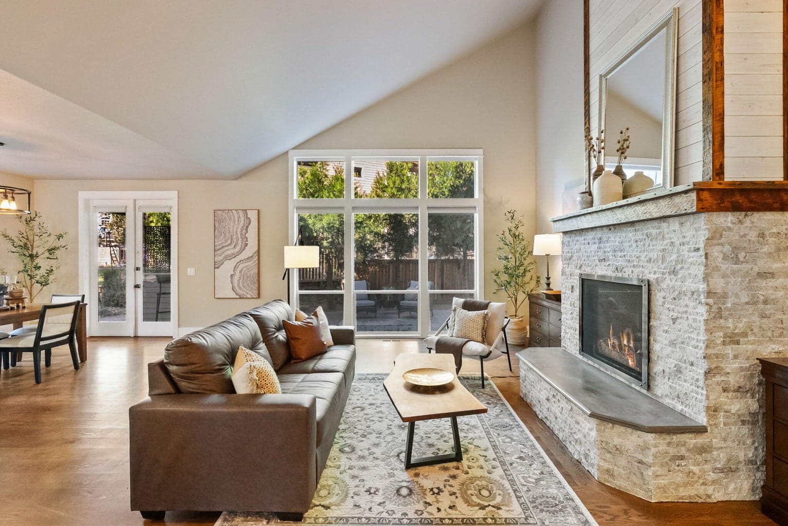 Great room with vaulted ceilings, propane fireplace and hardwood floors