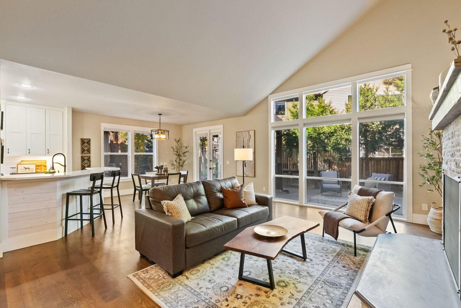 Great room with vaulted ceilings, propane fireplace and hardwood floors