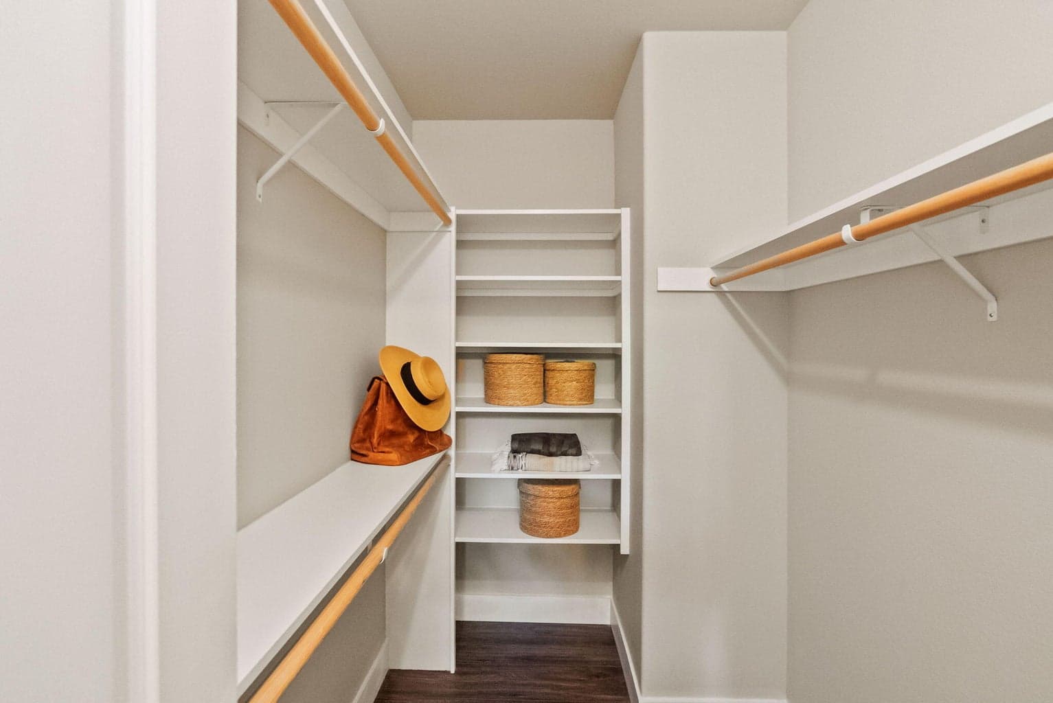 Primary suite on main level with new laminate floors, walk-in closet, barn doors to ensuite bath