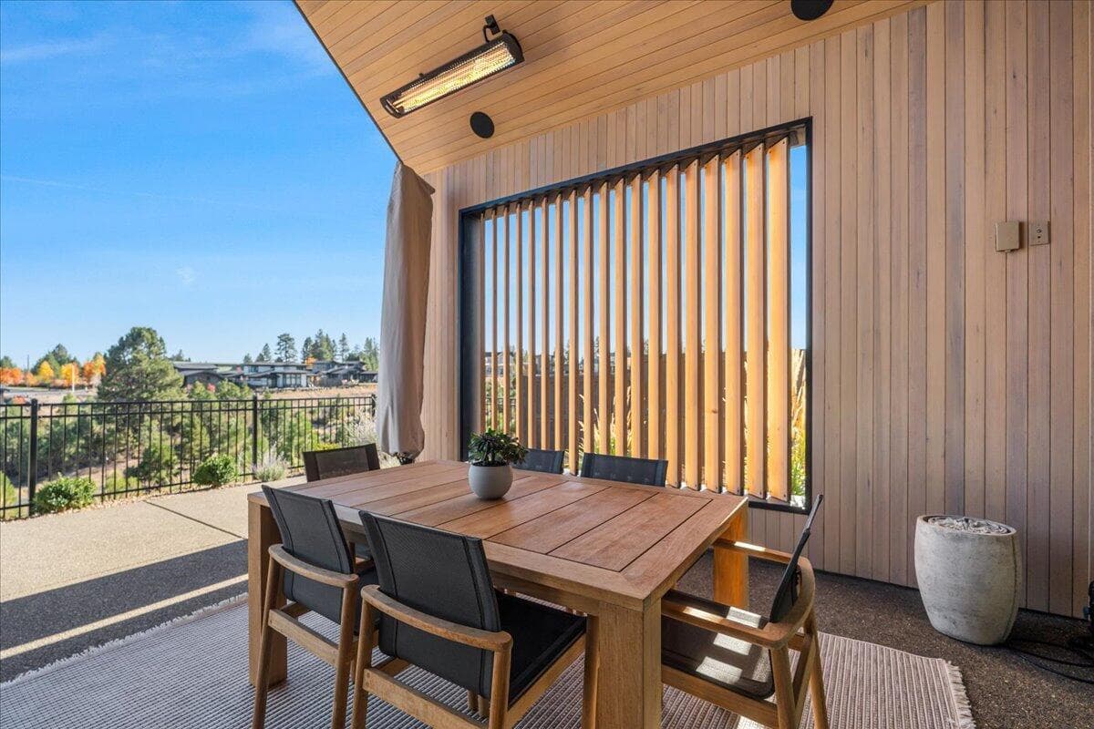 Sheltered dining with privacy and overhead heaters.