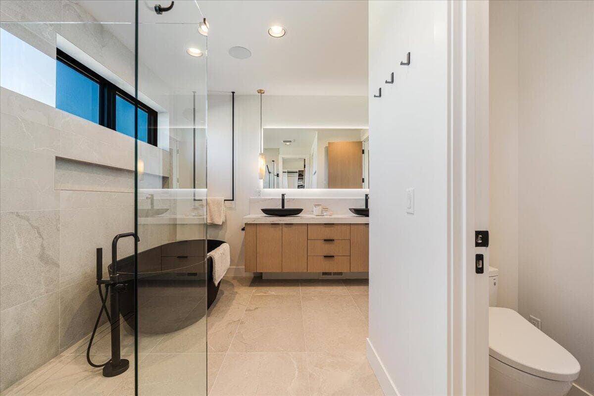 Soaking tub, heated floors, built-in speakers, and bidet in the primary