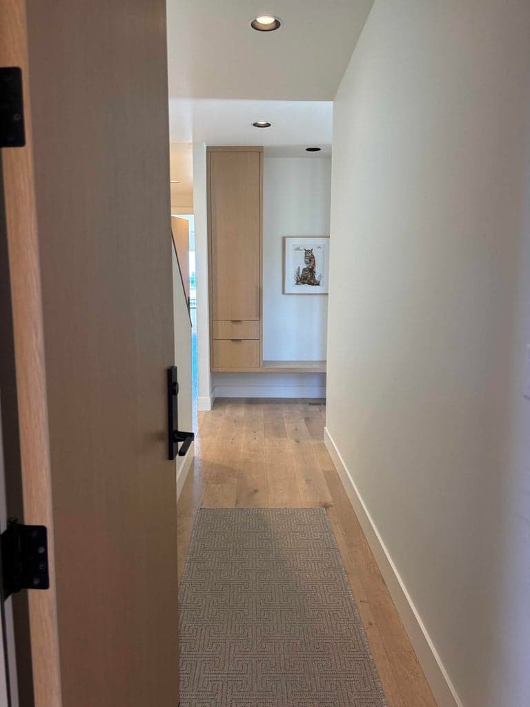 Bench and coat and shoe storage as you enter from garage to house.
