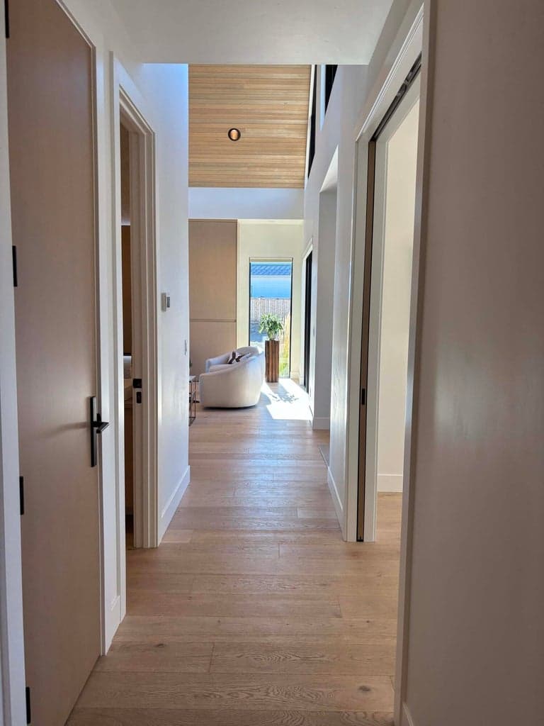 Sunlit view as you look toward the greatroom from laundry area.