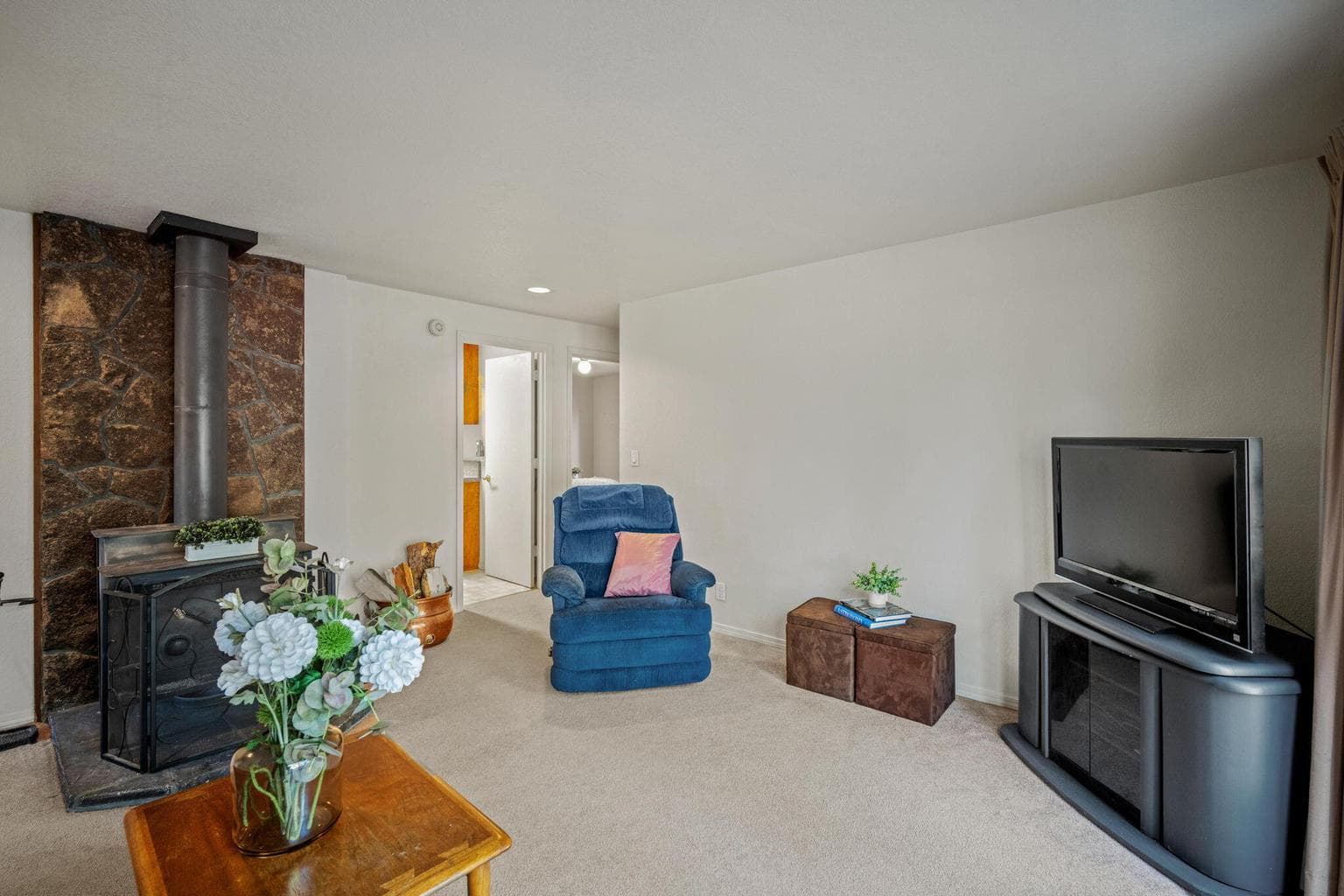 Family Room - looking back to hallway with laundry, full bathroom and 2 bedrooms.