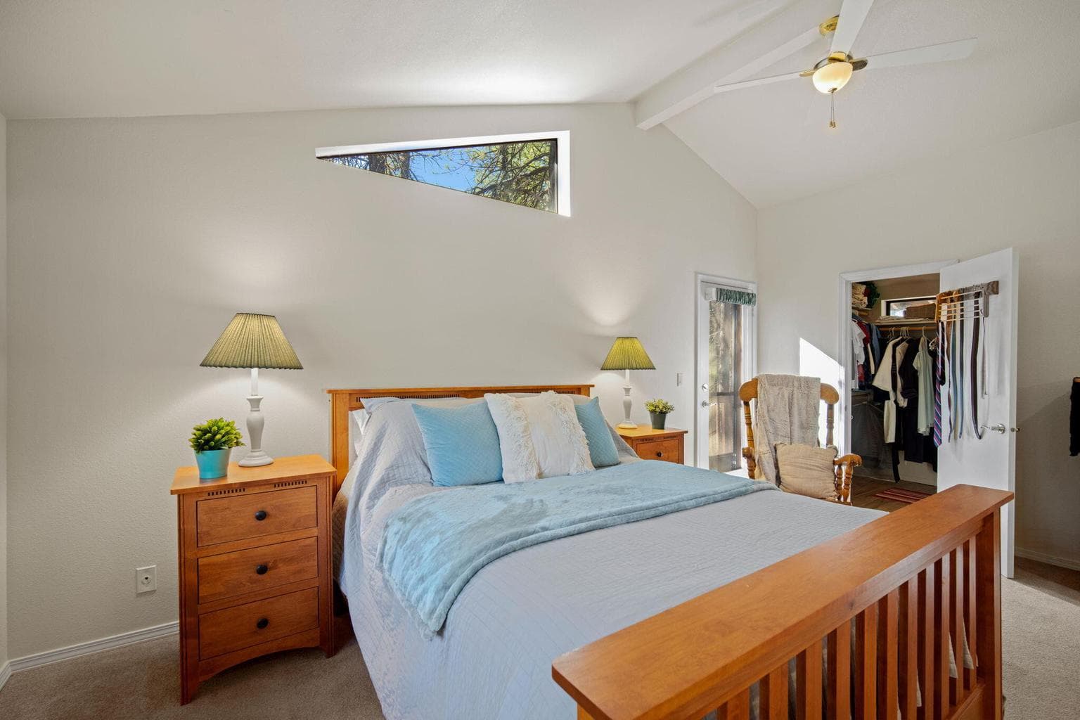 Dramatic vaulted ceilings and custom window let the light in to the Primary Suite.