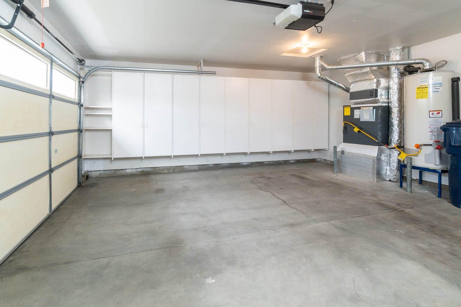 2 car garage with built in cabinets to ample storage.