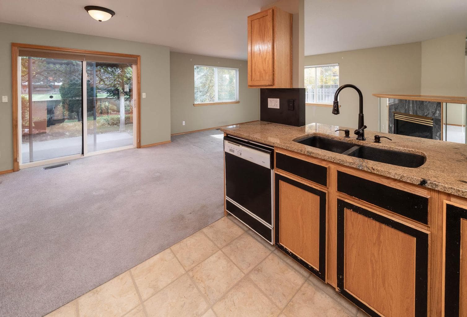 kitchen & dining area w/slider out to back patio and yard