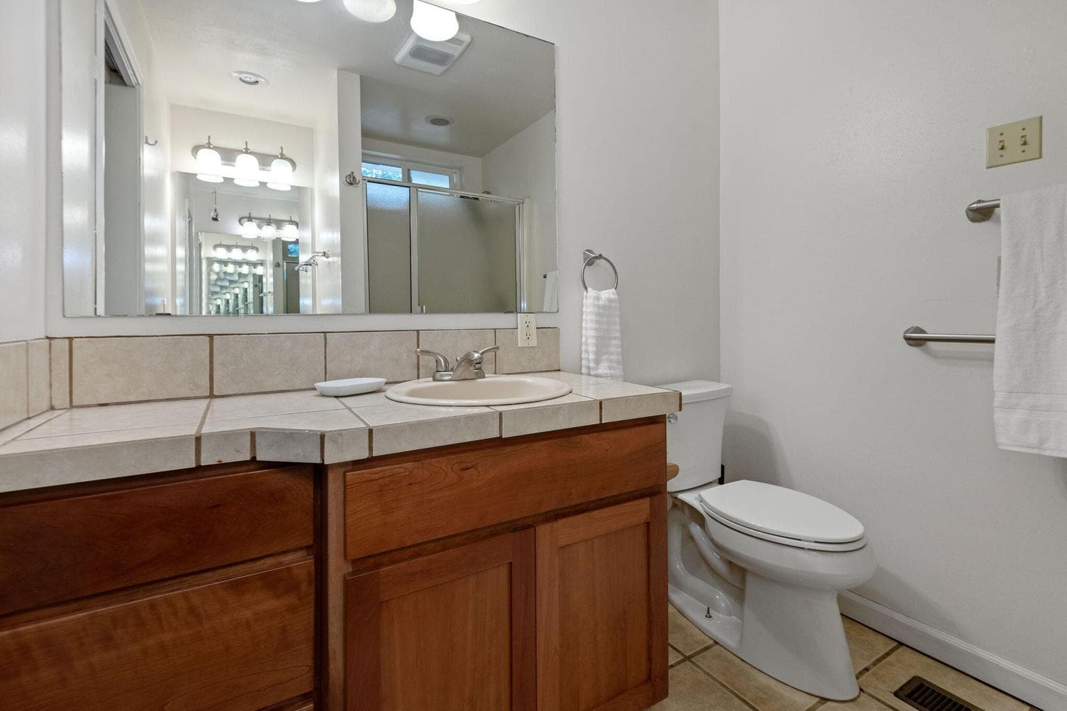Primary bathroom with dual sinks.