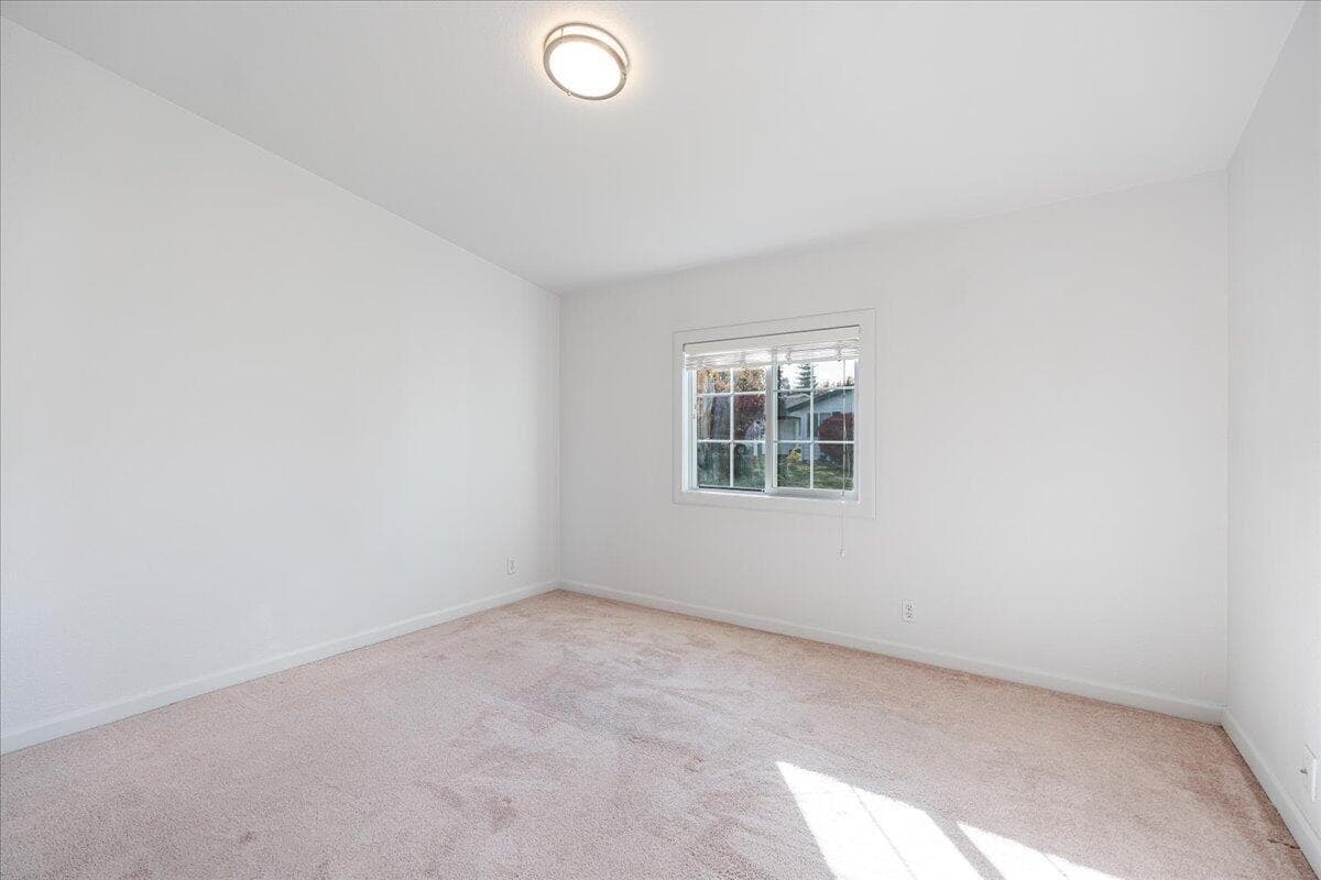 Larger secondary bedroom view from hallway.
