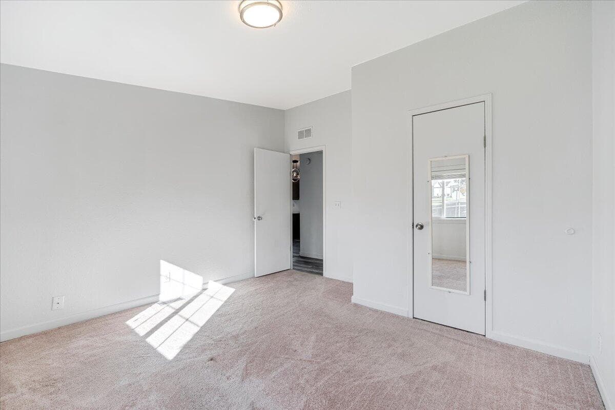 Larger secondary bedroom with walk-in closet