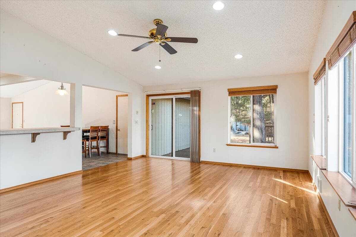 This living room offers lots of natural light and a slider to you back deck