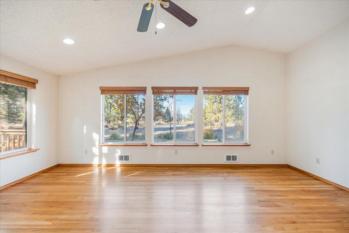 Your second living room has a vaulted ceiling and oak hardwood flooring