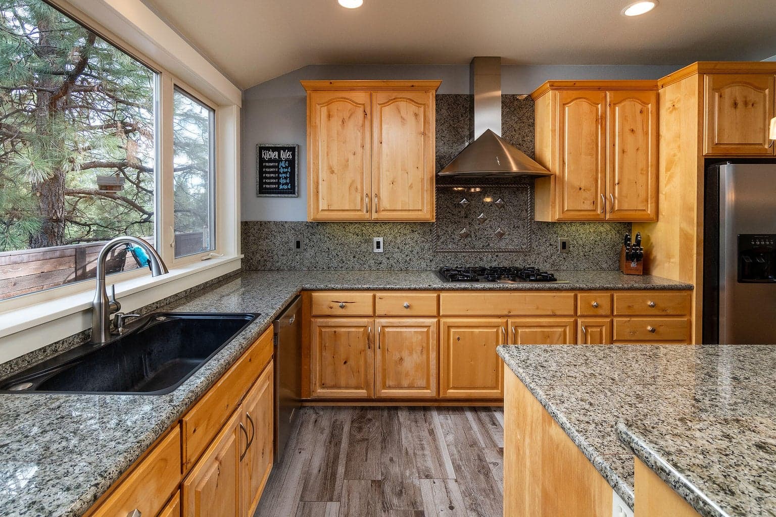 spacious kitchen with granite counters and stainless steel appliances