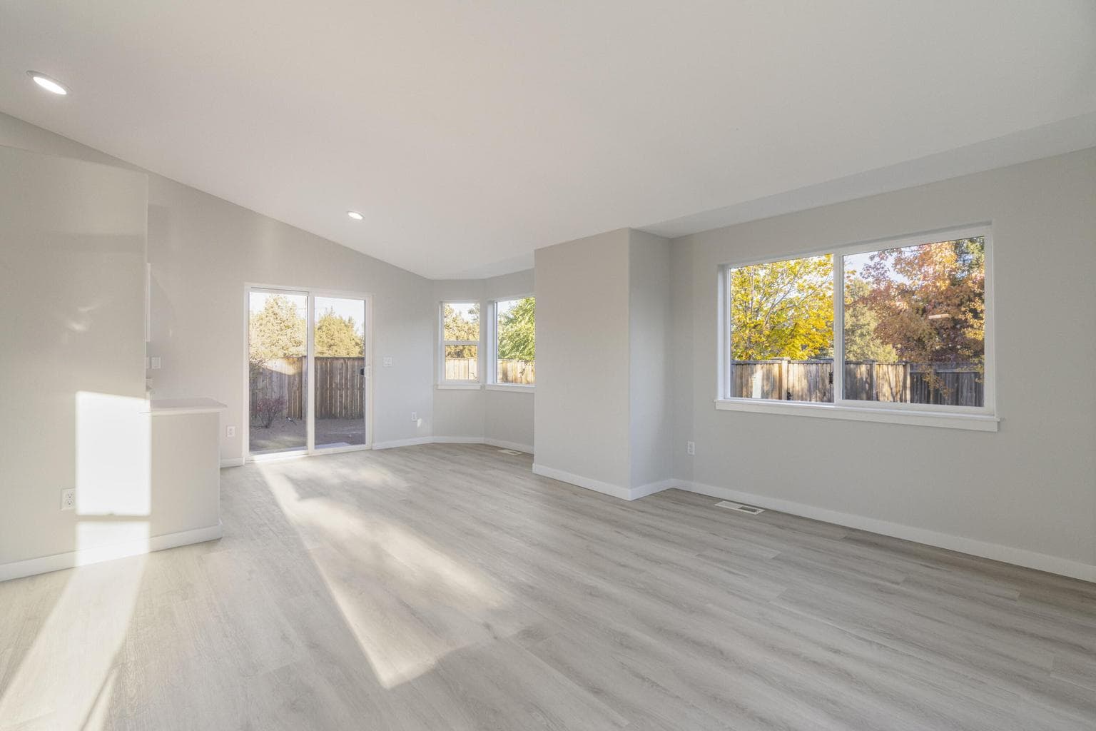 Great Room to Dining Area - notice all the big new windows & all that natural light!